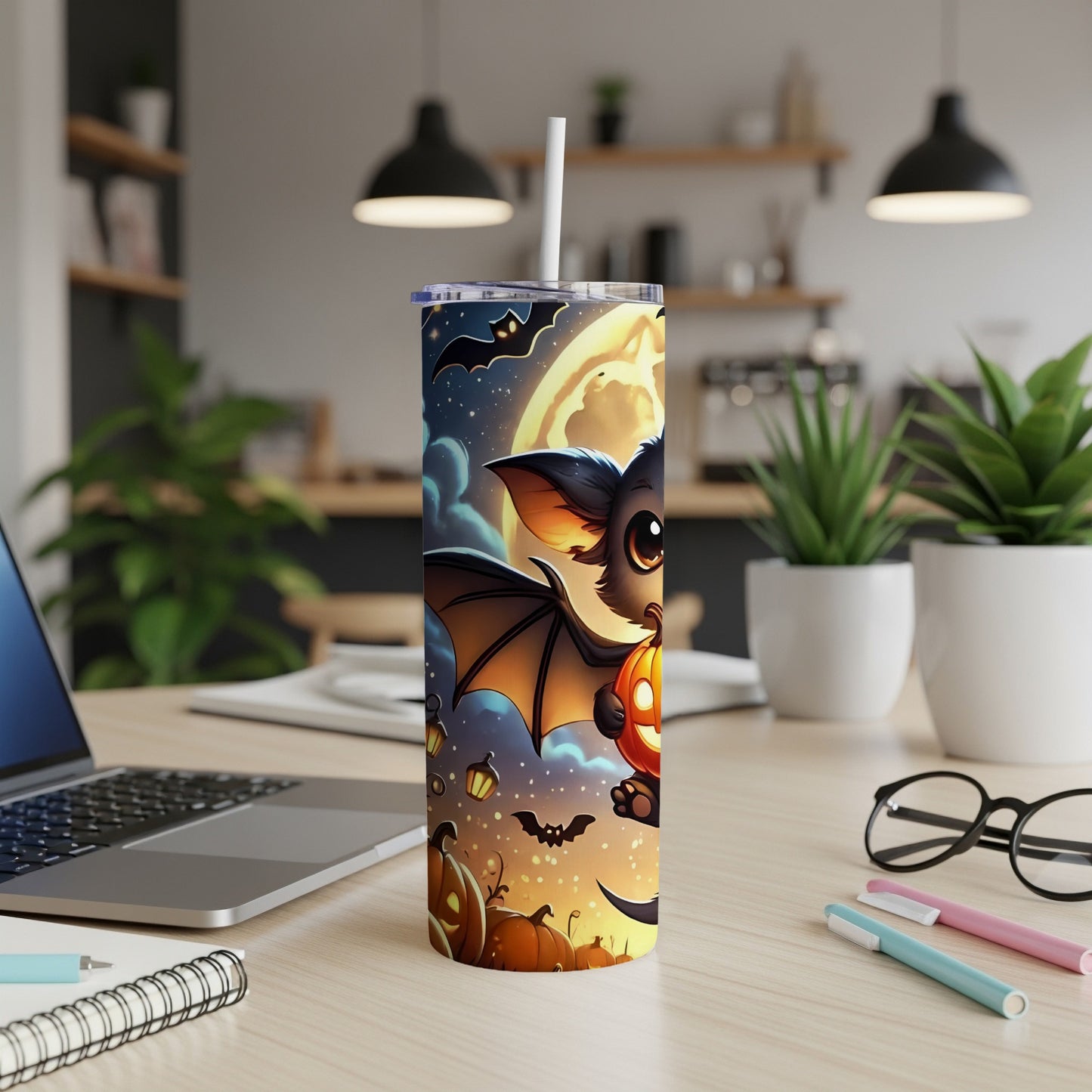 Halloween tumbler with cartoon bat, pumpkins, and full moon design.
