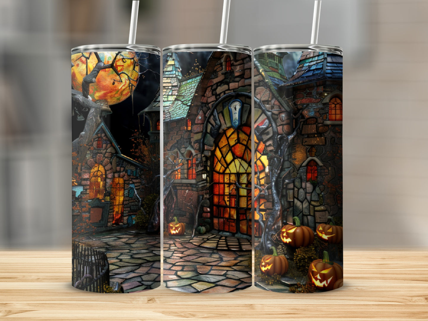 Spooky Halloween tumbler with haunted house and pumpkins.