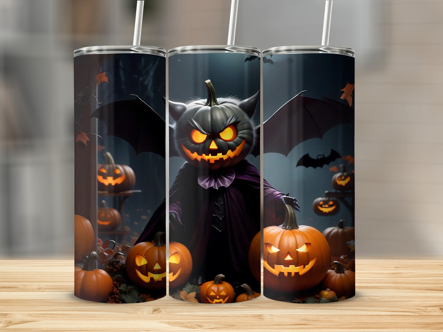 Three tumblers with Halloween pumpkins, bats, and a spooky jack-o'-lantern figure.