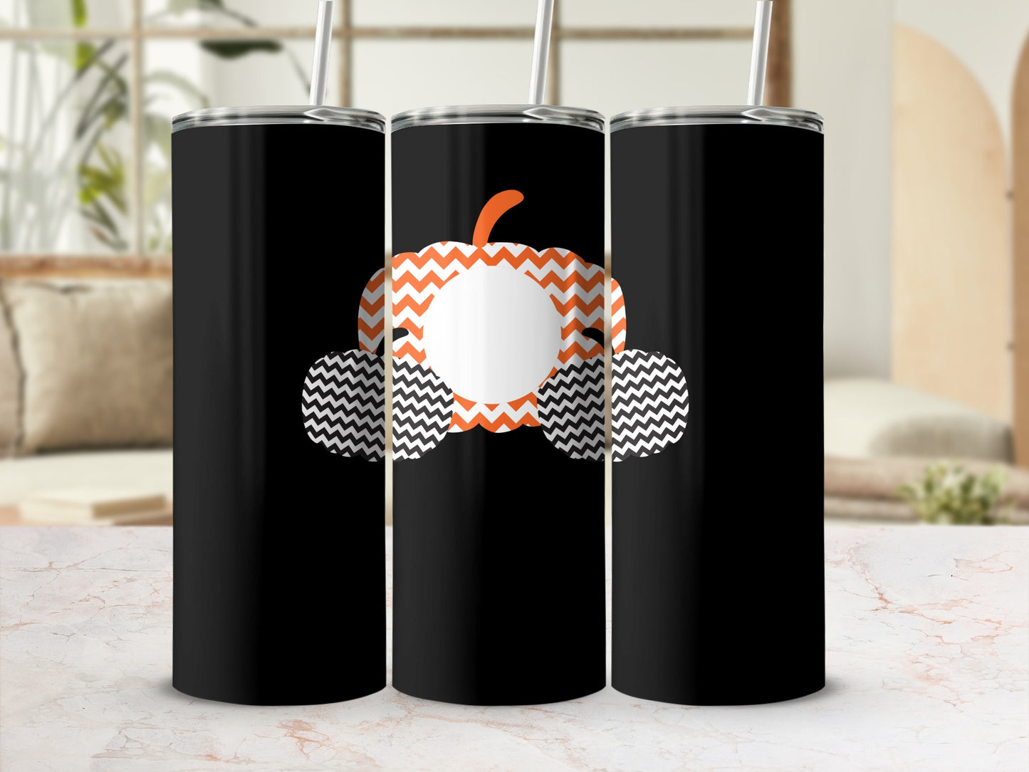 Black tumbler with orange and white chevron pumpkin graphic and personalization circle.