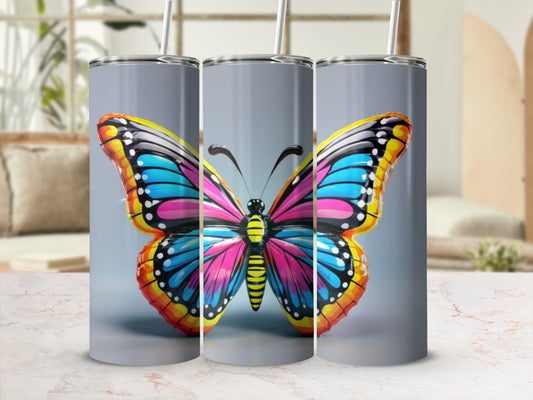 Colorful butterfly design on a set of three tumblers.
