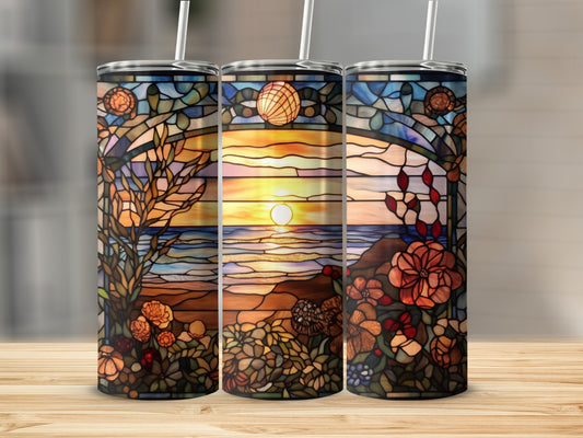 Stained glass tumbler with sunset ocean view and floral accents.