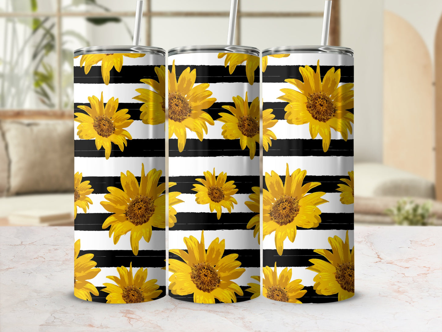 Three tumblers with sunflowers on black and white stripes.