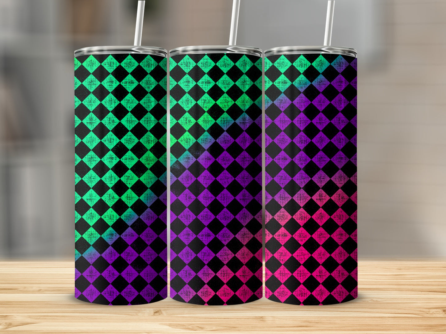 Three tumblers with a neon harlequin diamond pattern in green, purple, and pink.