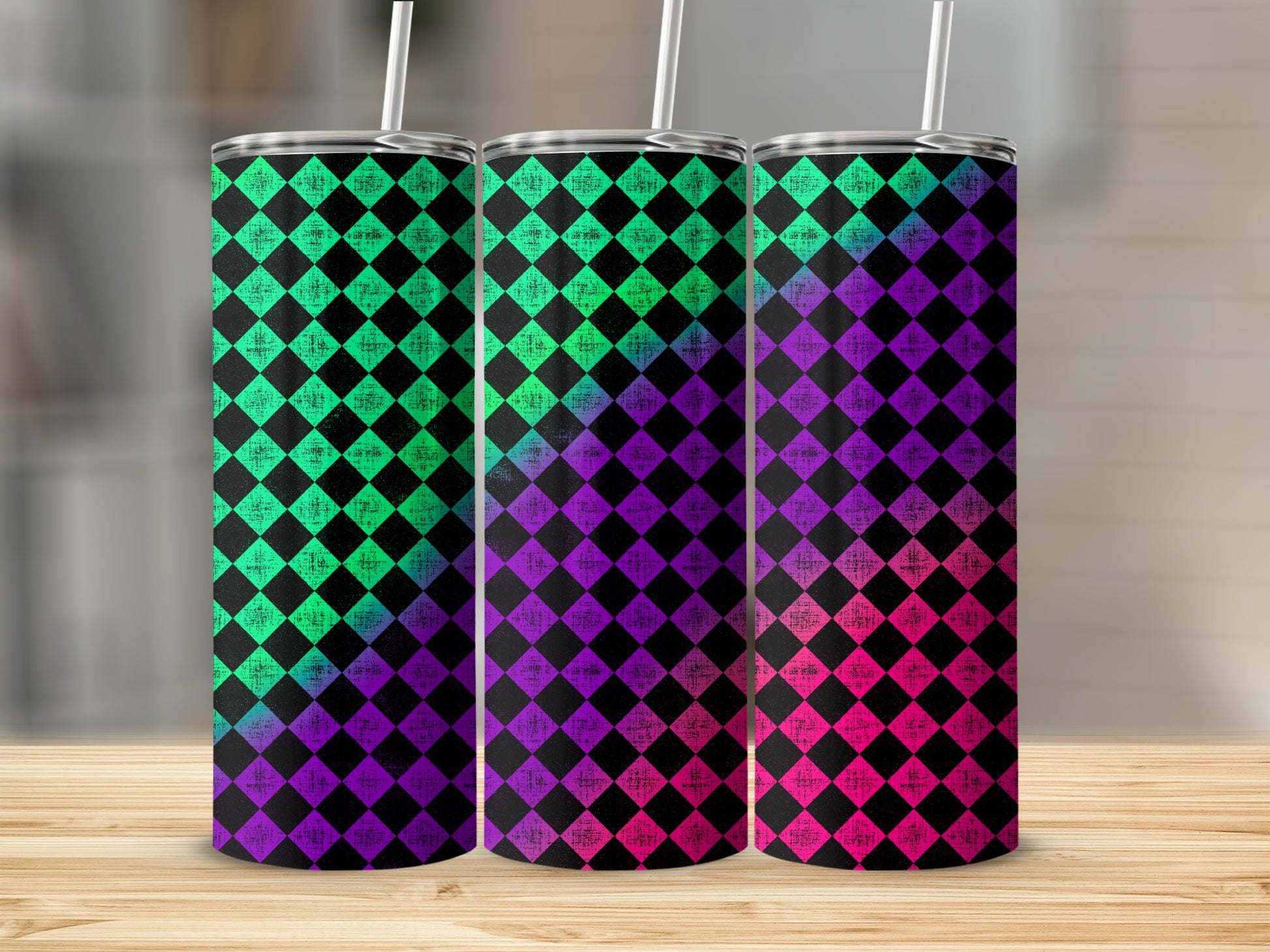Three tumblers with a neon harlequin diamond pattern in green, purple, and pink.