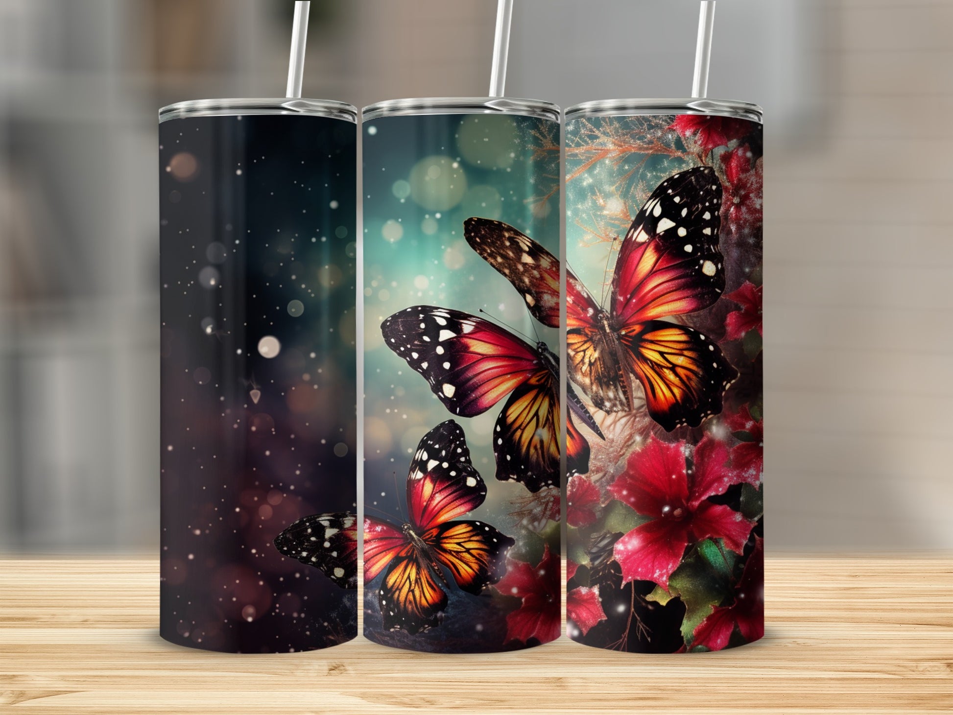 Three tumblers featuring colorful butterflies and floral designs on dark backgrounds.
