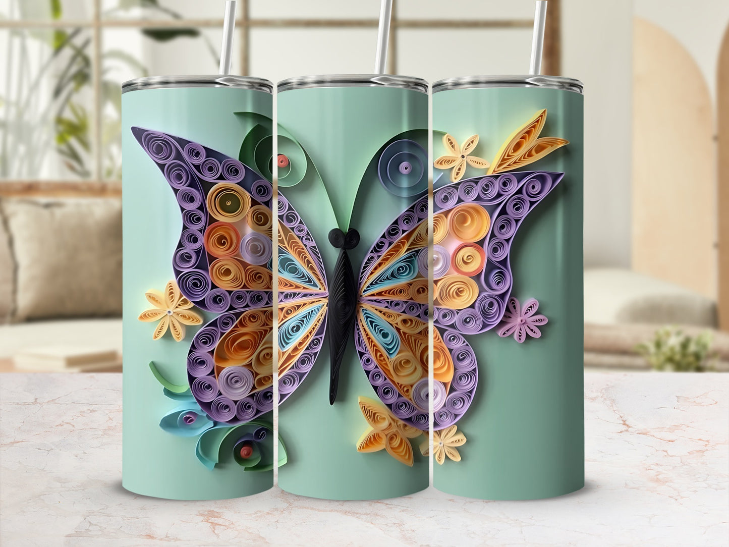 Three tumblers with colorful quilled paper butterfly designs and straws.