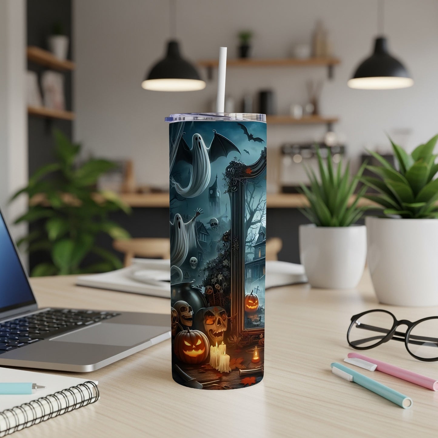 Tall tumbler with Halloween design featuring ghosts, bats, pumpkins, and skulls.
