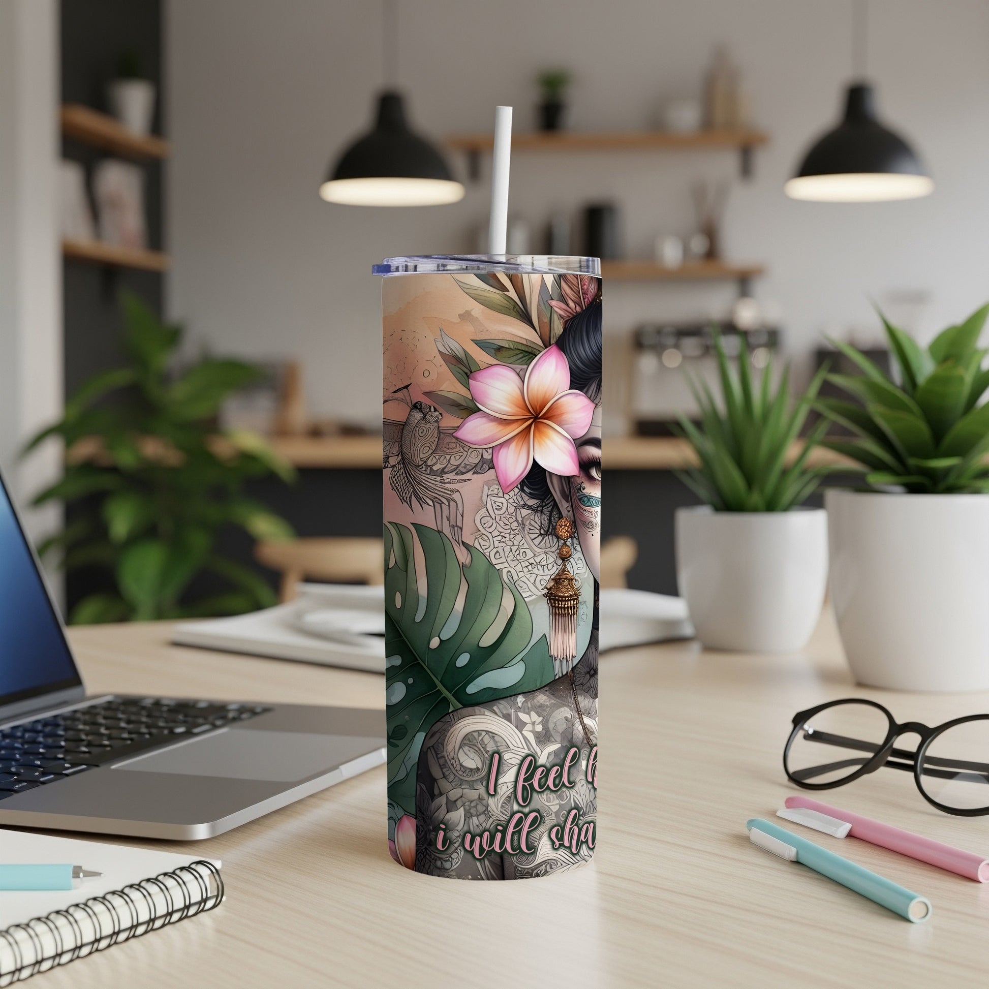 Tumbler featuring woman with floral tattoos and a flower in her hair.
