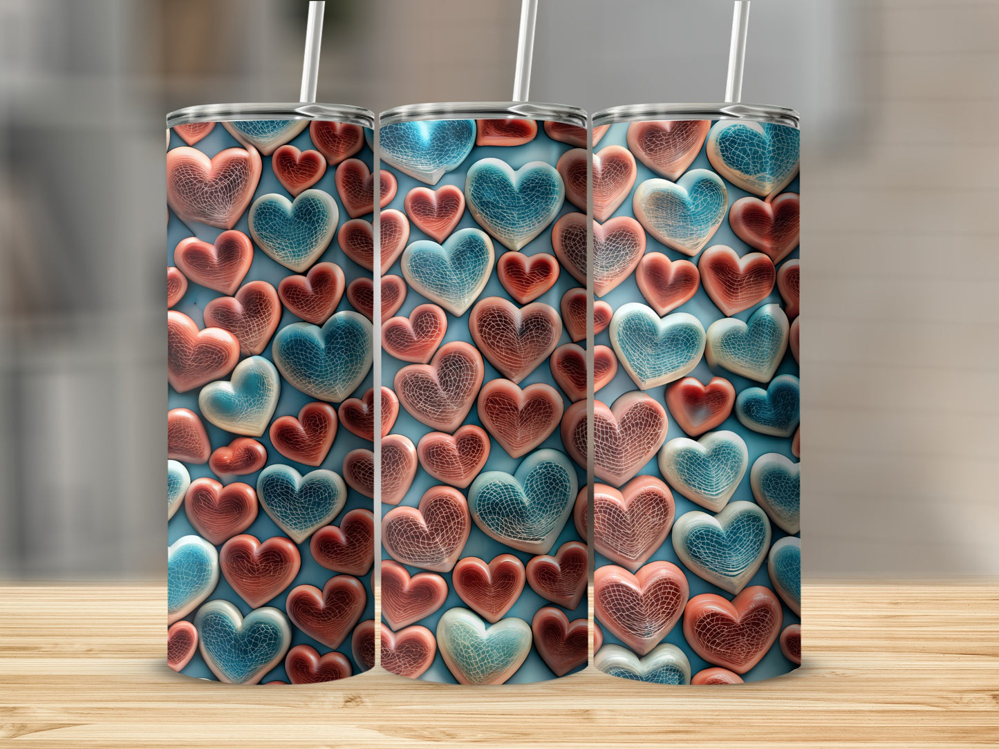 Three tumblers with textured heart pattern in red and blue hues.