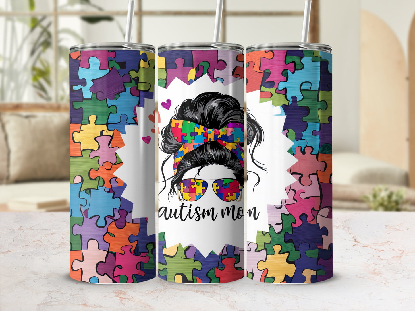 Autism mom tumbler with colorful puzzle piece design and messy bun.