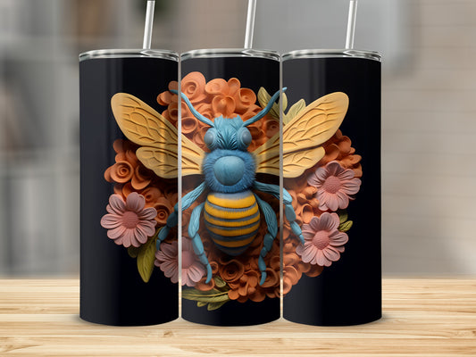 Three black tumblers with a blue and yellow bee and floral design.