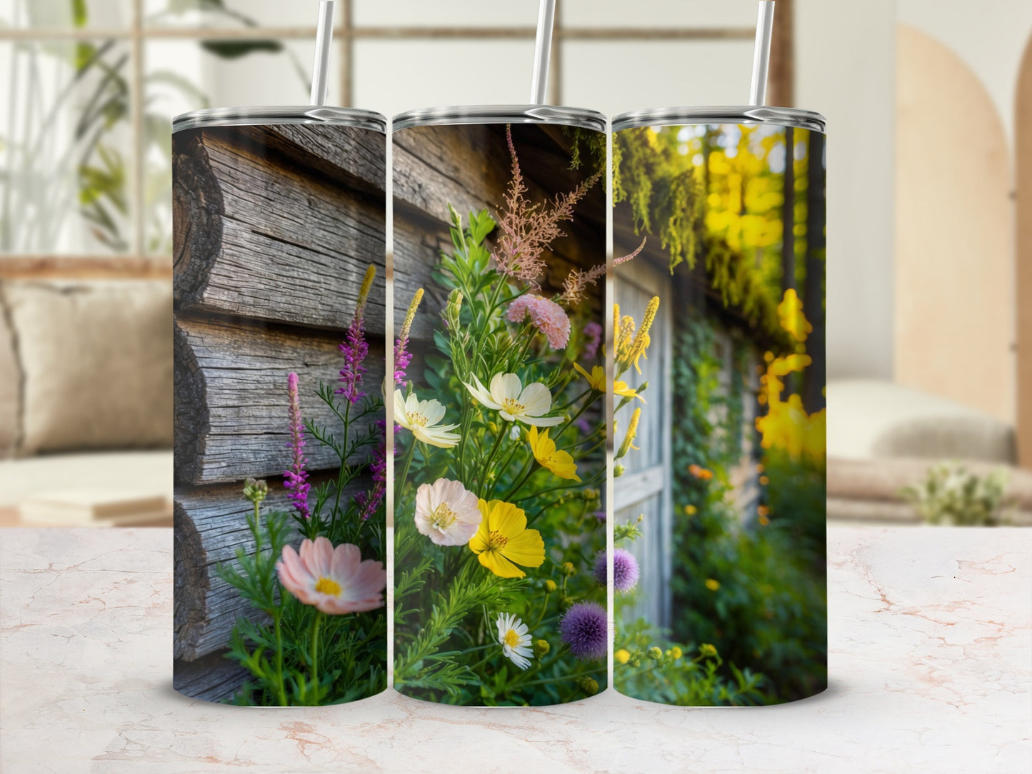 Three tumblers with floral designs against a rustic wooden background.