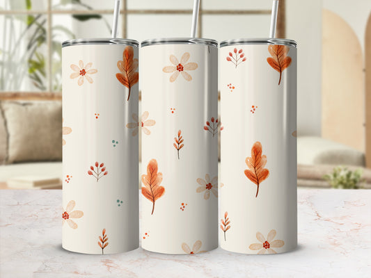 Three cream-colored tumblers with a fall leaf and floral pattern.