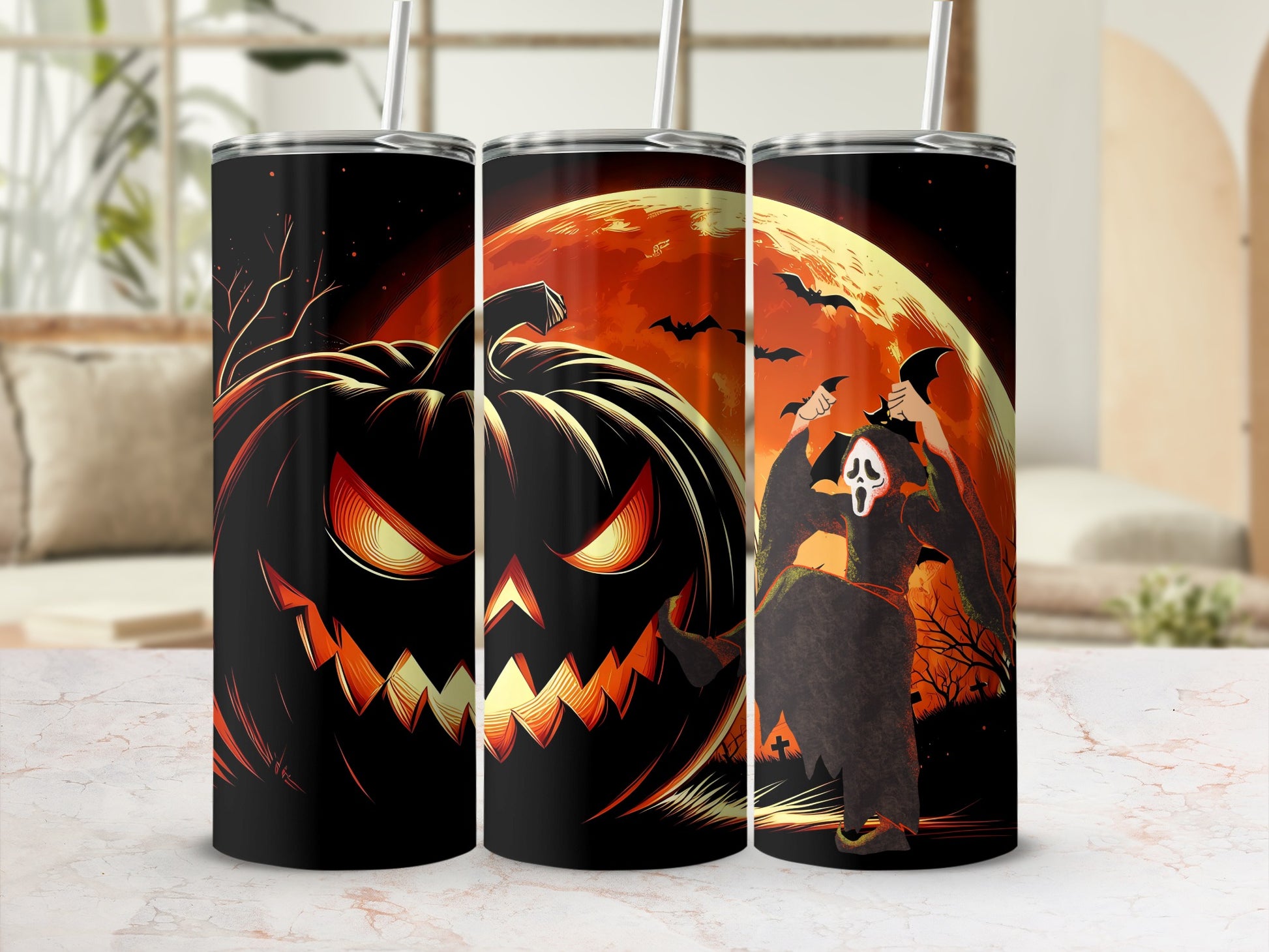 Three tumblers featuring Halloween art with a jack-o'-lantern and a ghost.