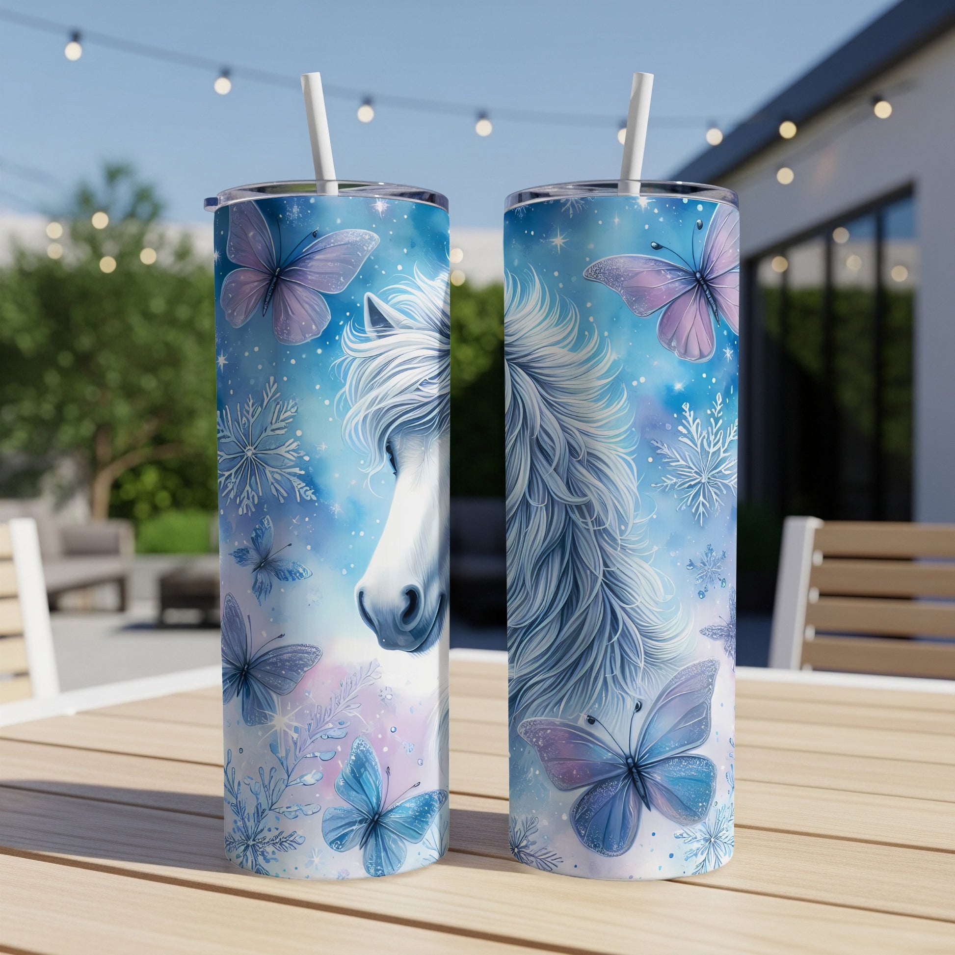Unicorn with butterflies and snowflakes on a blue background.