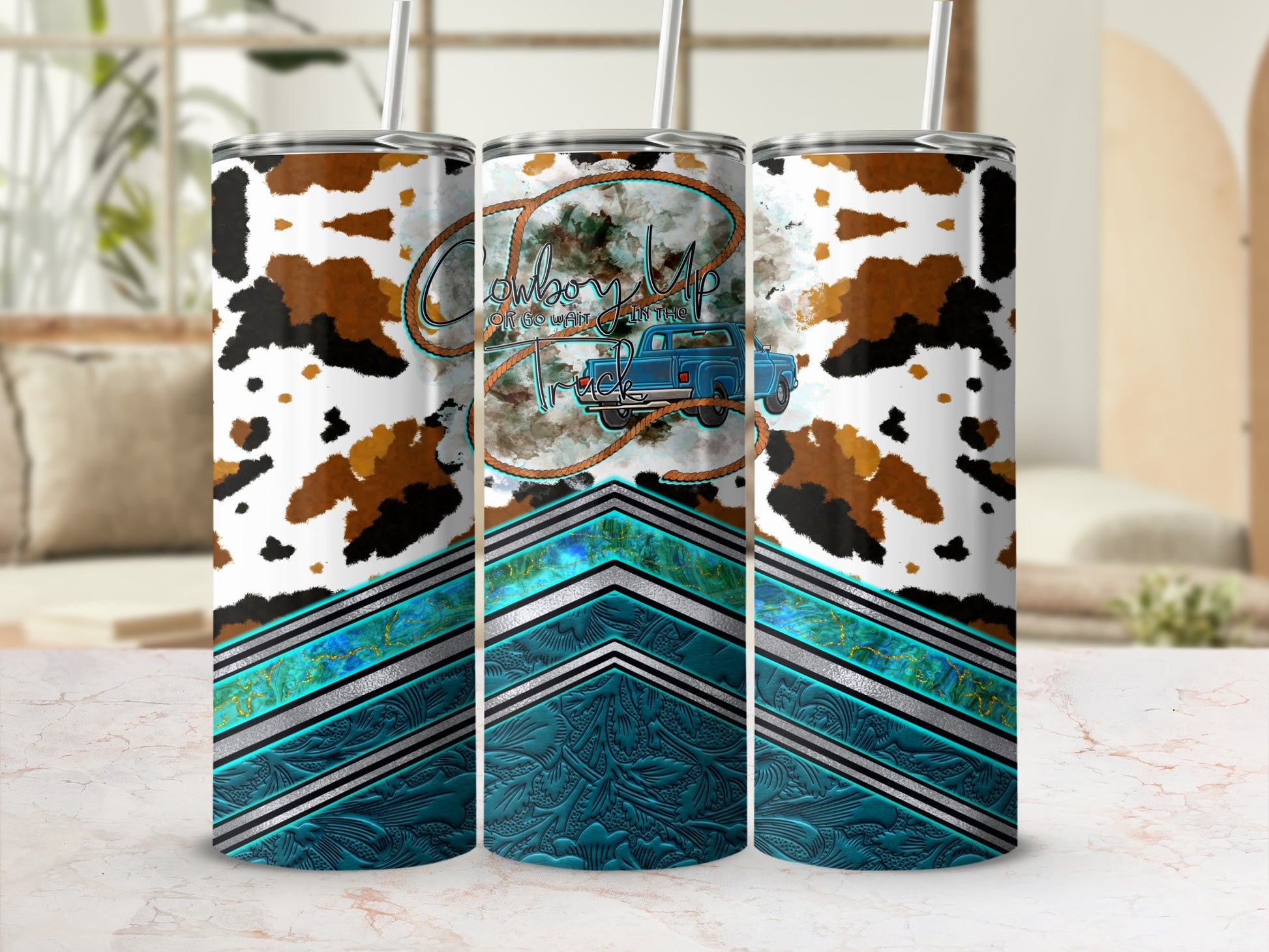 Cowboy truck design on a tumbler with cow print and turquoise accents.