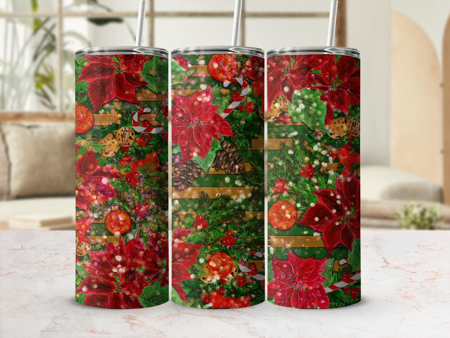 Three tall tumblers with a red poinsettia, pinecone, and glitter Christmas pattern.