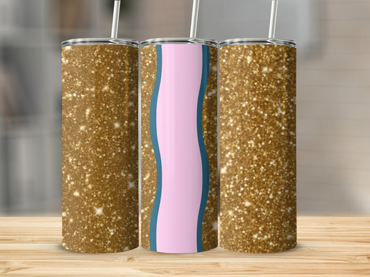 Three glitter tumblers with pink and blue wavy design on wood surface.
