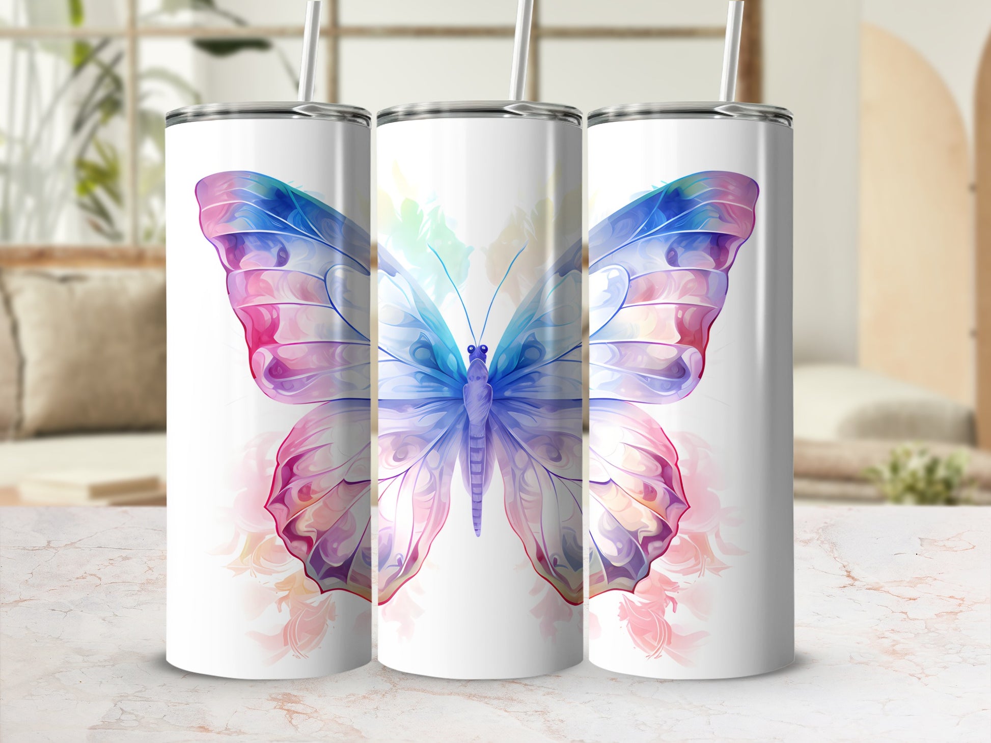Butterfly tumbler with pink and blue wings and straws.