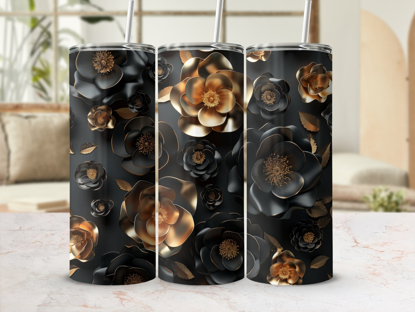Black and gold floral pattern on three tumblers with straws.