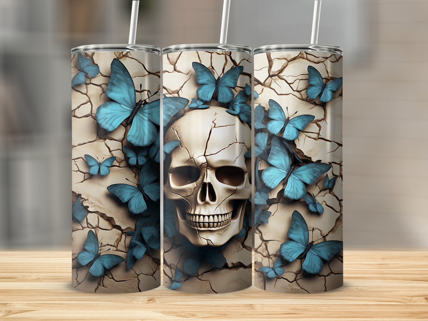 Cracked earth skull with blue butterflies, presented on three tumblers.