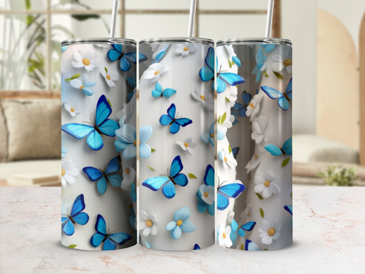 Three tumblers with blue butterflies and white flowers.