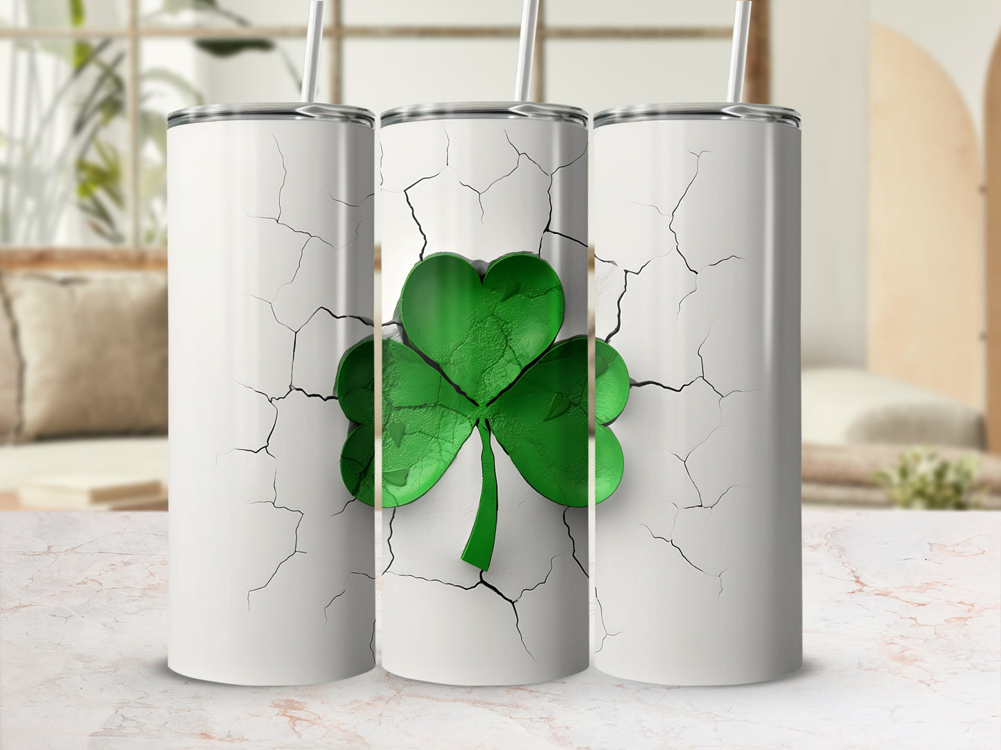 Three white tumblers with a cracked design and a green shamrock.