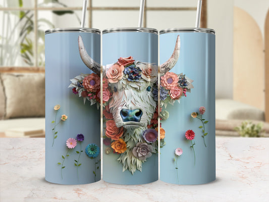 Blue floral Highland cow tumbler with floral accents.