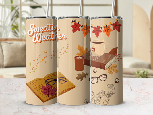 Tan tumbler with "Sweater Weather" and autumn leaves design.