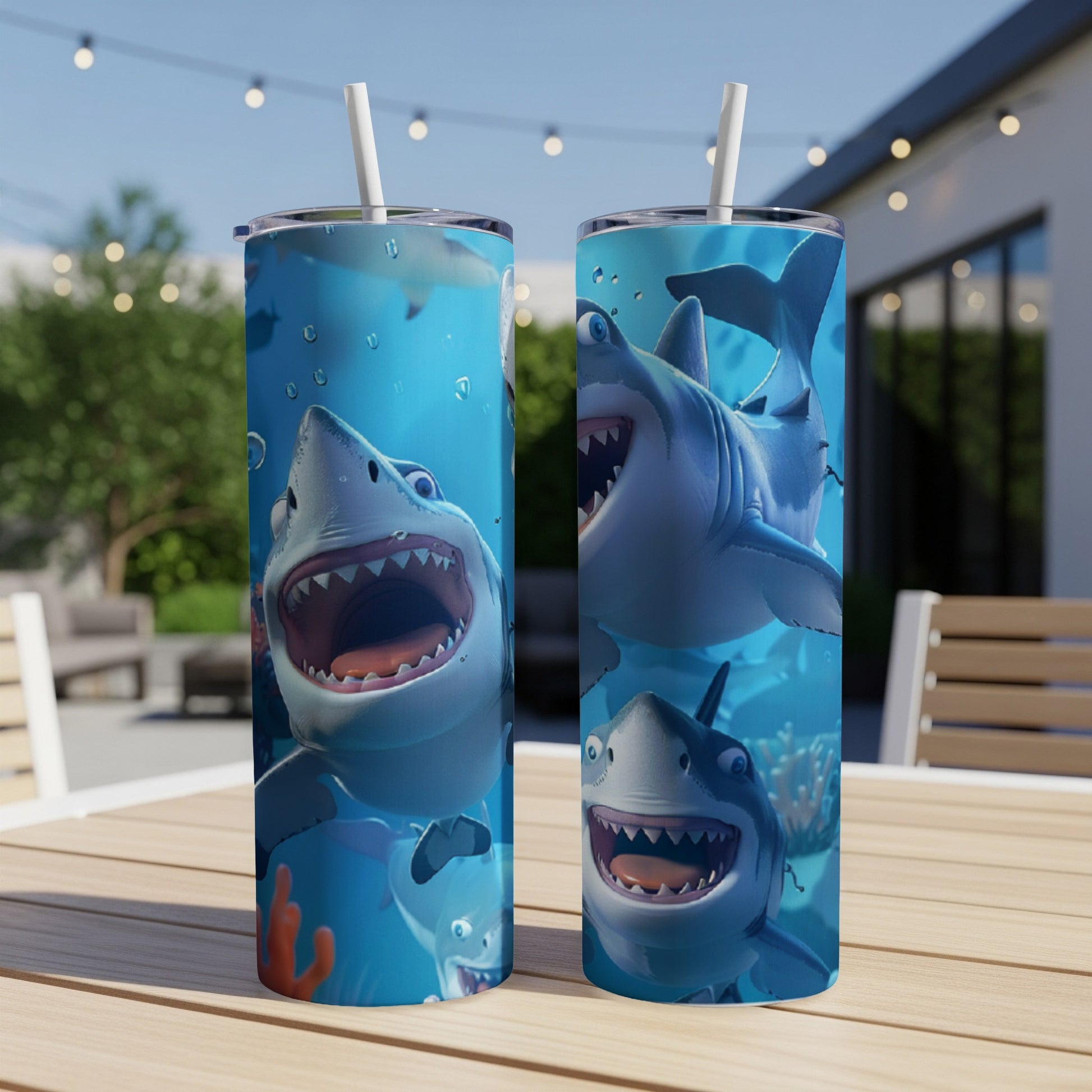 Two tumblers with cartoon sharks smiling underwater.