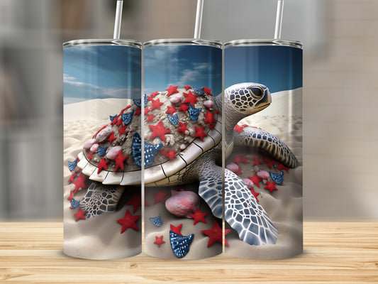 Turtle adorned with red and blue stars on sandy beach.