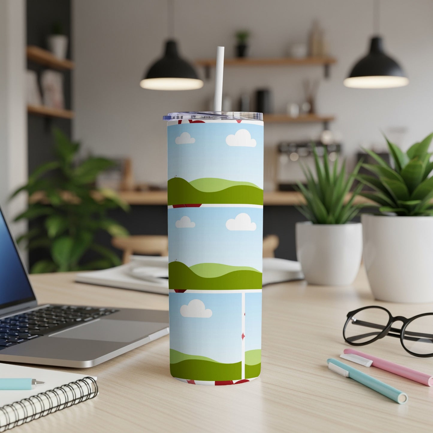 Tumbler with rolling green hills and red barn graphic design.