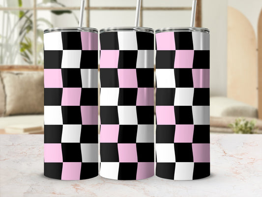 Pink, black, and white checkered tumblers with straws on a marble surface.