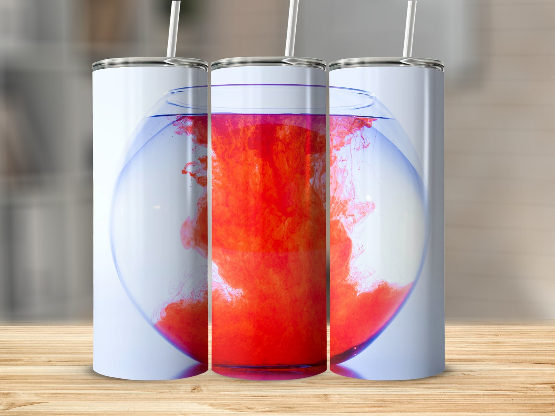 Three tumblers with a red liquid cloud swirling in a fishbowl.