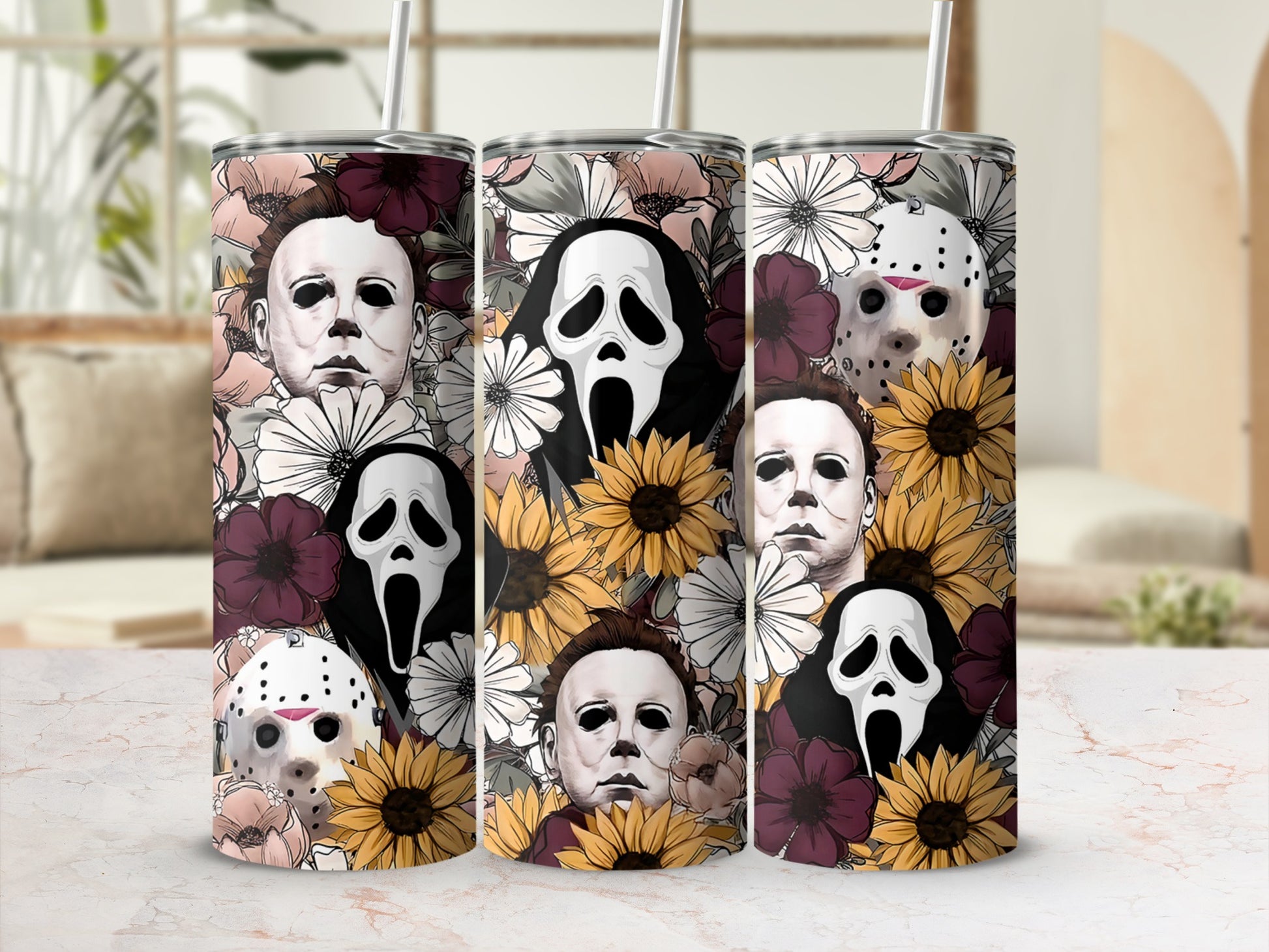 Three tumblers feature horror movie characters and floral designs.