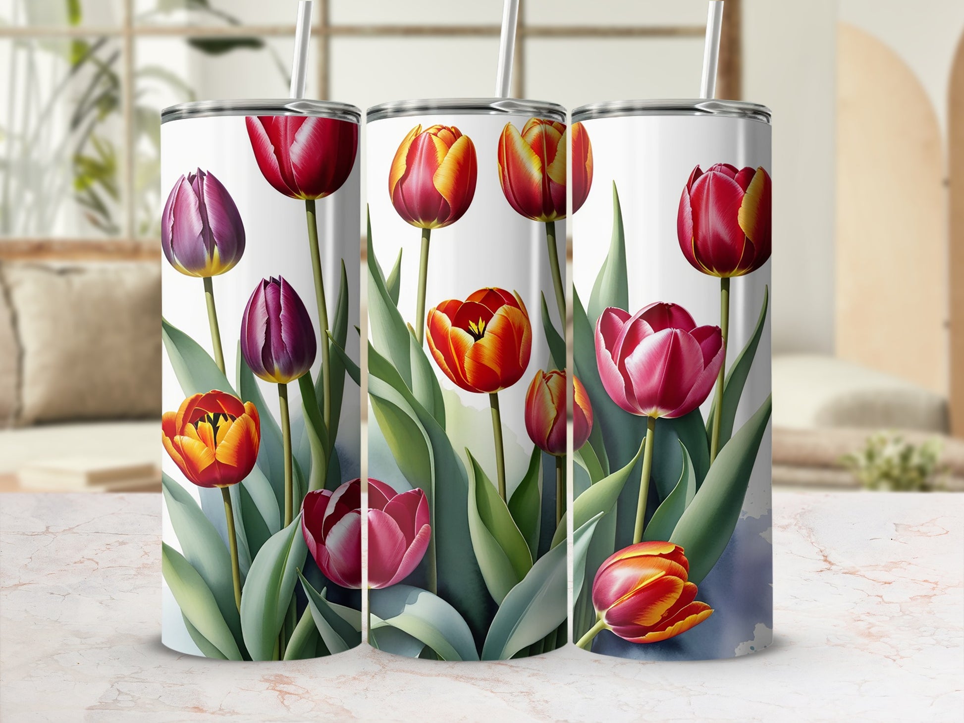 White tumblers decorated with a watercolor pattern of red, orange, and purple tulips.