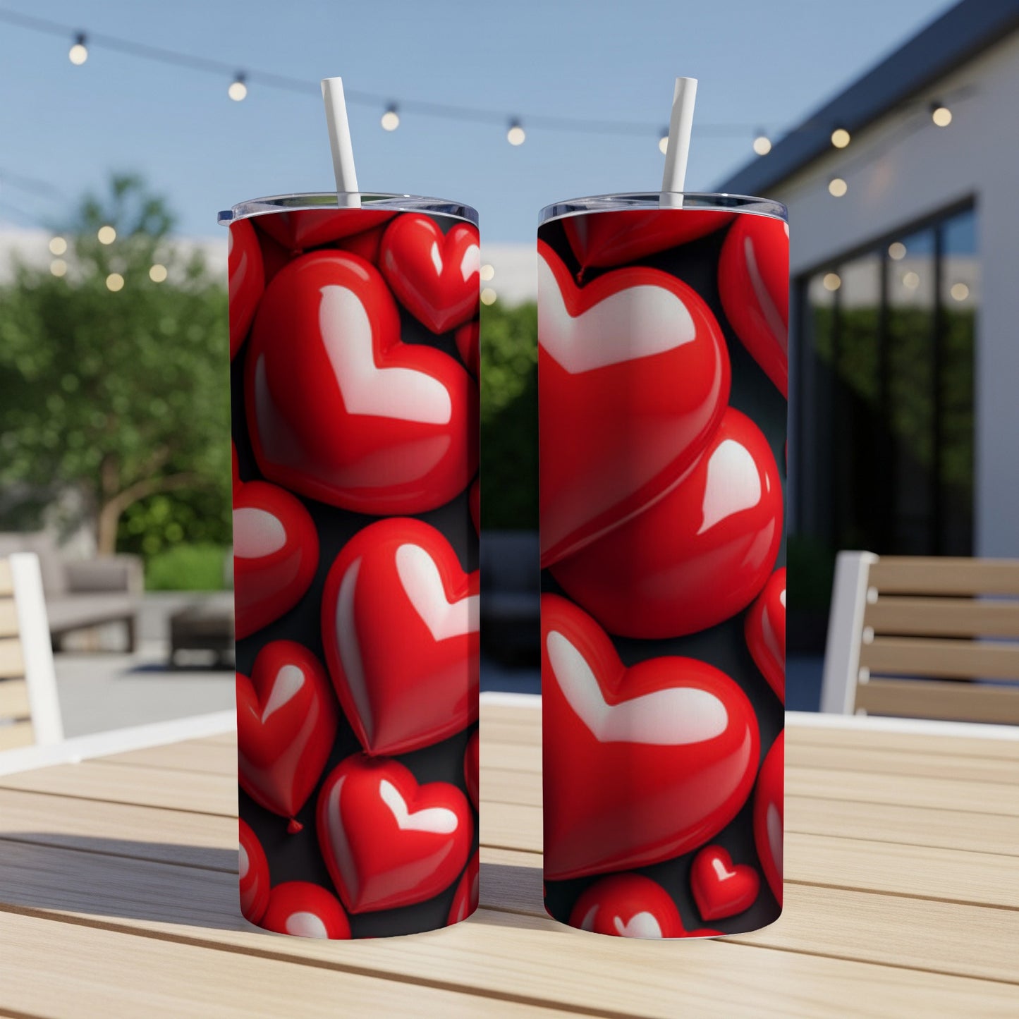Two red heart-covered tumblers on a table.