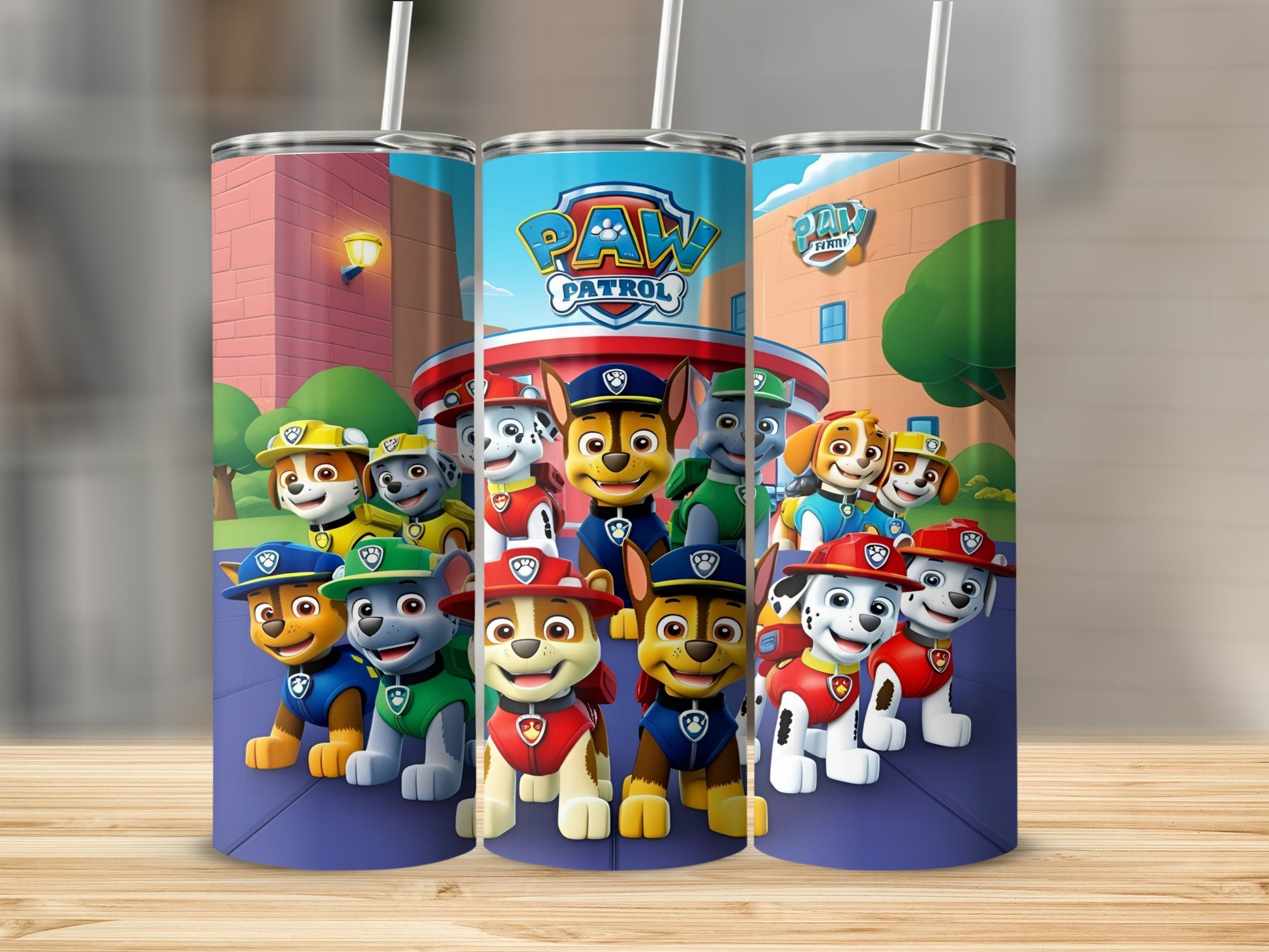 Paw Patrol characters on a blue and white tumbler with straws.