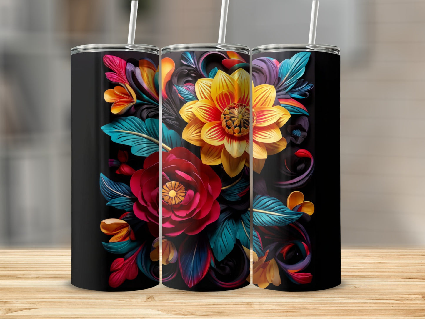 Three black tumblers featuring vibrant, stylized floral designs.