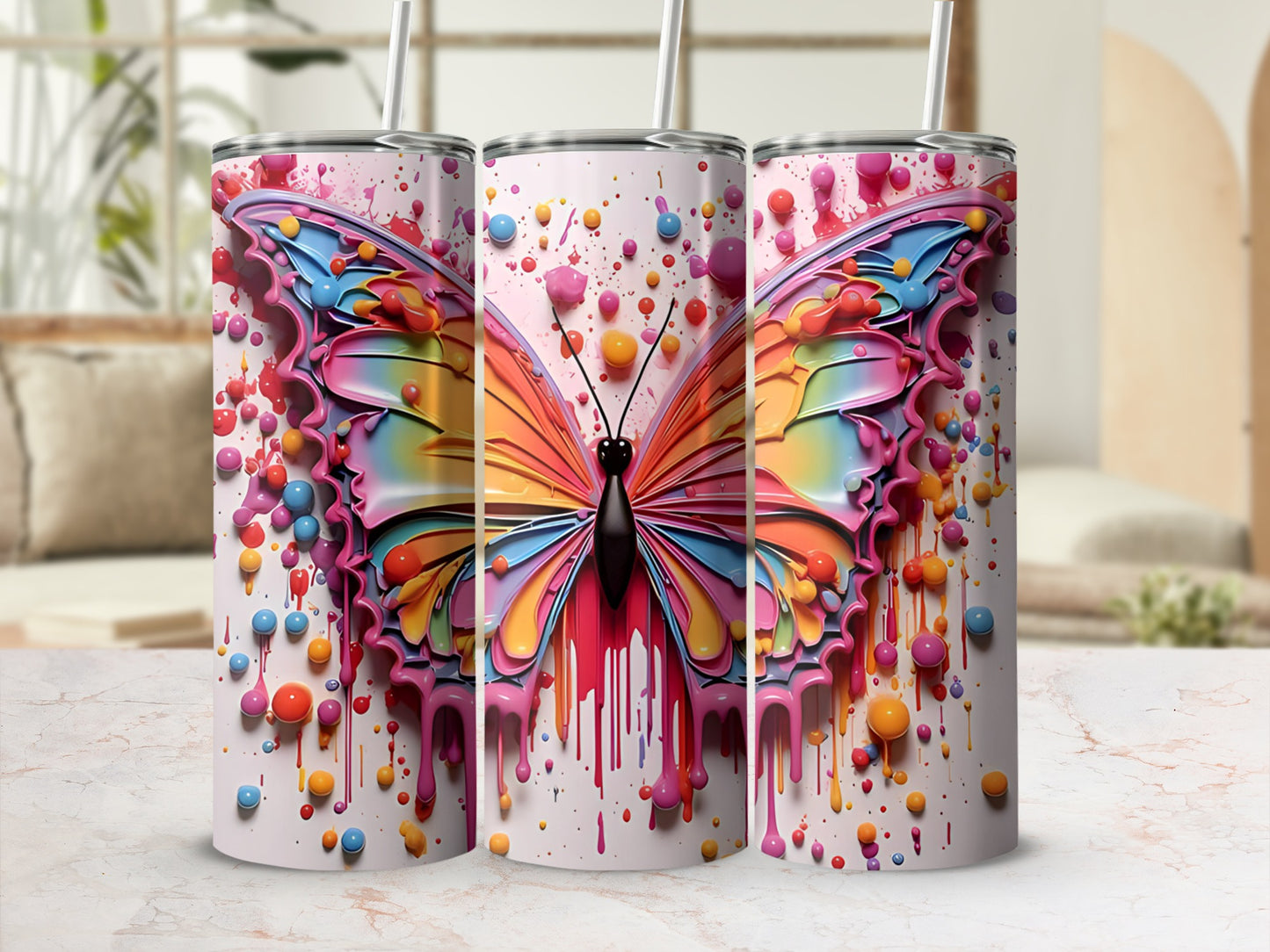 Colorful butterfly design on a white tumbler with pink drips.