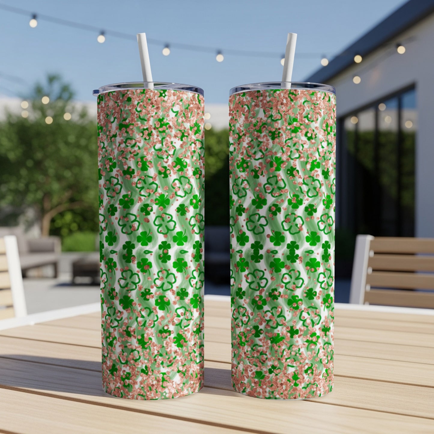 Two tall tumblers with shamrock and glitter pattern.