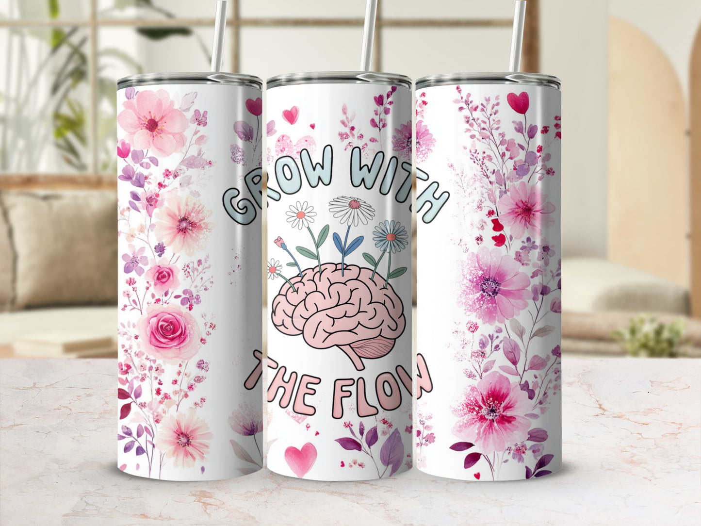 Pink floral tumbler with brain graphic and "Grow with the Flow" text.