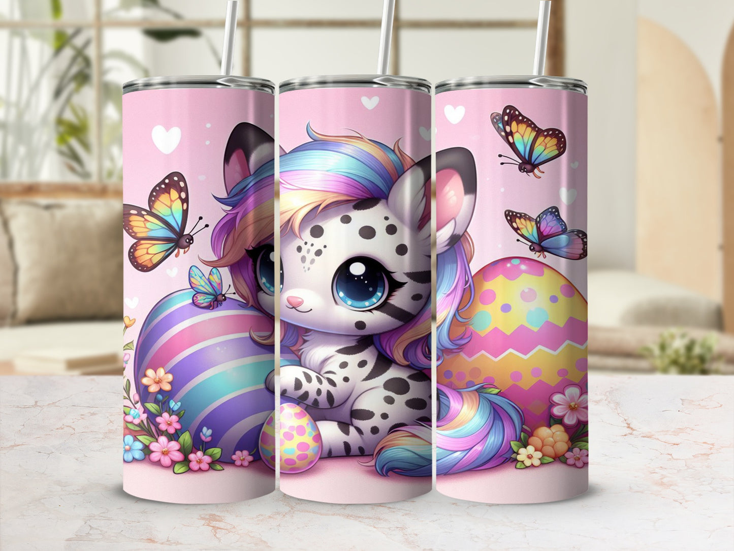 Cartoon snow leopard with rainbow mane on pink tumbler with Easter eggs and butterflies.