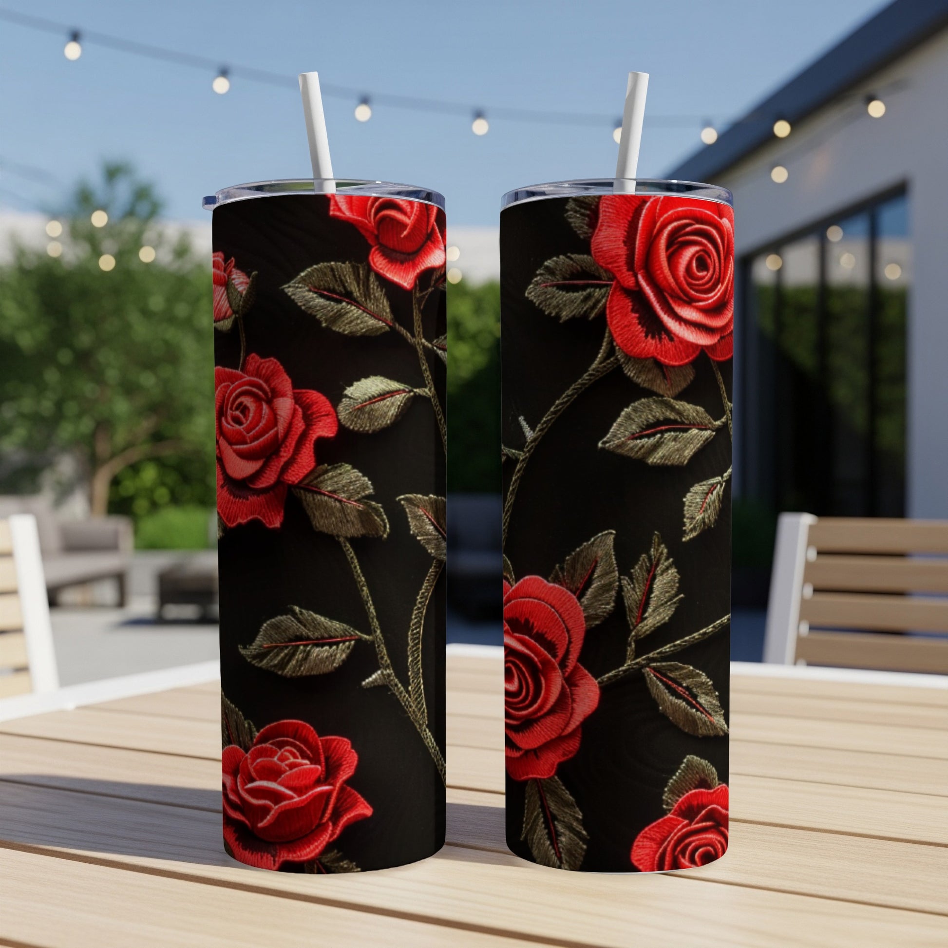Black tumbler with red rose embroidery and green vines.