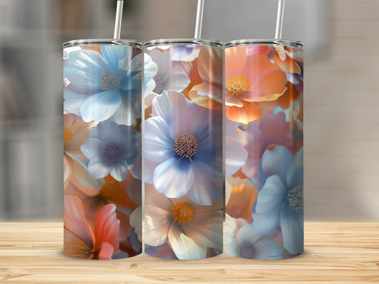 Three tumblers with a watercolor floral design in blues, oranges, and white.