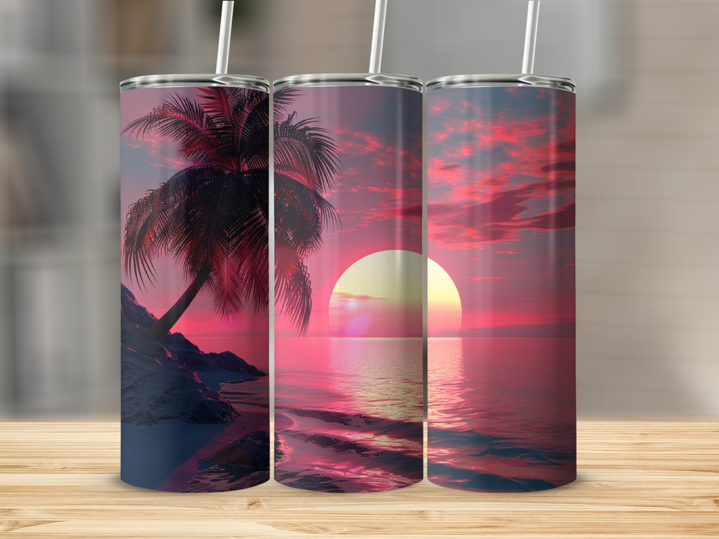 Three tumblers with a vibrant sunset over the ocean and palm trees.
