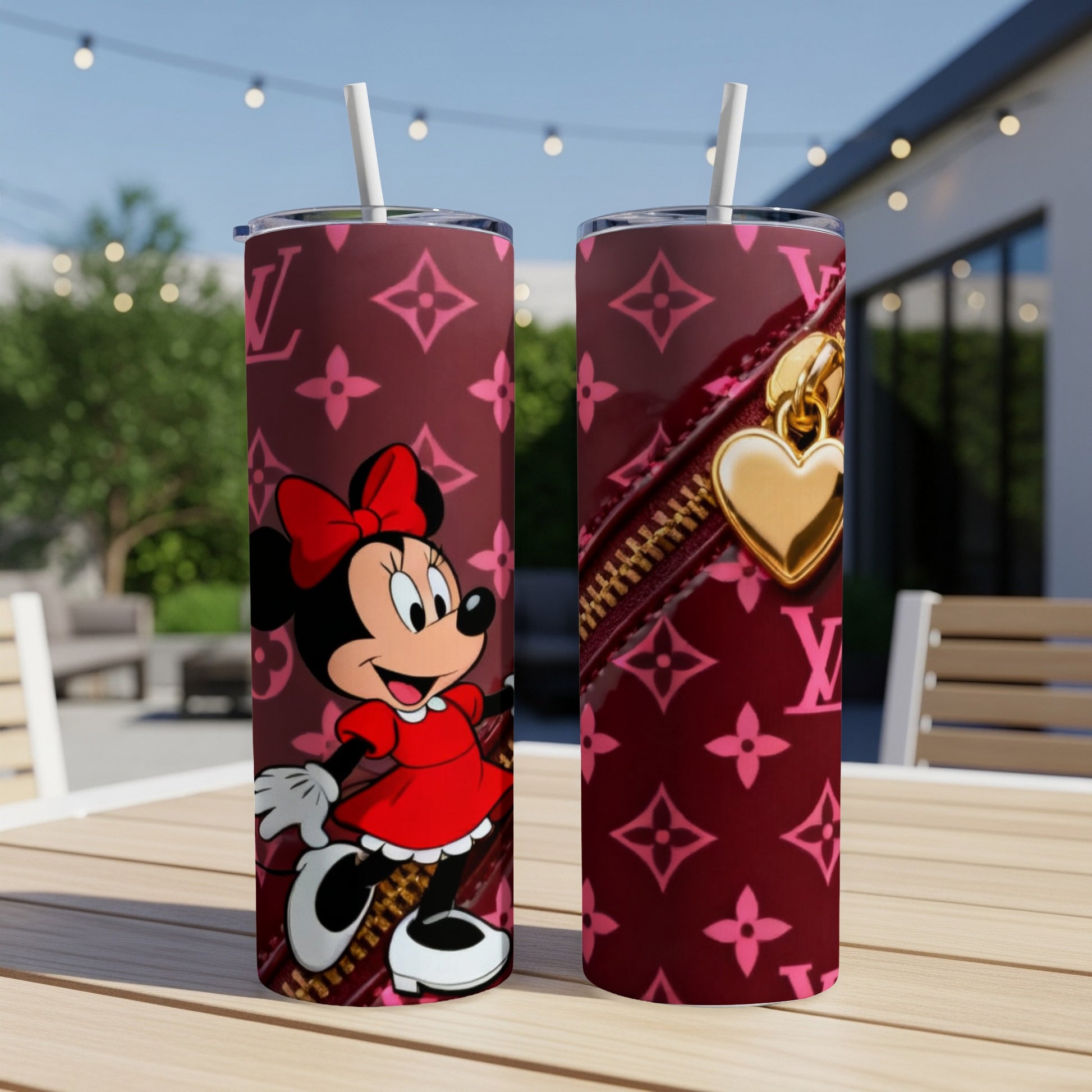Pink tumbler with Minnie Mouse and gold heart zipper detail.