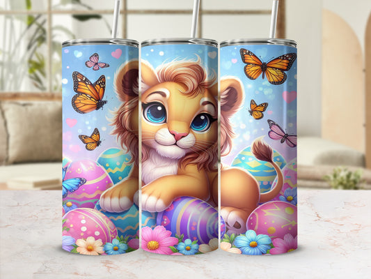 Cartoon lion with butterflies and Easter eggs on a tumbler.