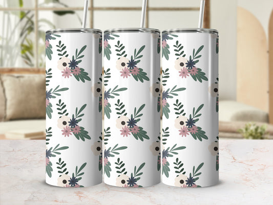 Three tumblers with floral pattern on a marble surface.